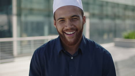 portrait-of-young-middle-eastern-man-standing-laughing-office-outdoor-campus-businessman