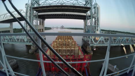 empty containervessel sailing true bridges