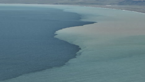 different salt water contacting in north iceland sea aerial view