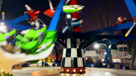 spinning and whirling airplanes at the fantasilandia amusement park in santiago, chile.