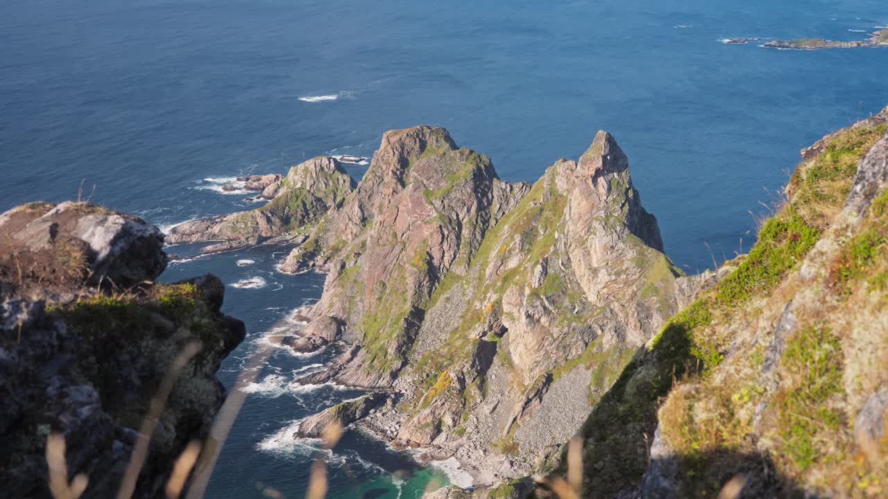 Majestic cliffs towering over the ocean at Måtinden, Norway with rugged rock formations