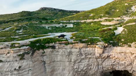discover the raw natural splendor of miġra l-ferħa, with its iconic limestone escarpments, scenic walking paths, and panoramic sea views, all captured by drone.