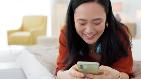 Social-media,-happy-and-asian-woman-on-bed