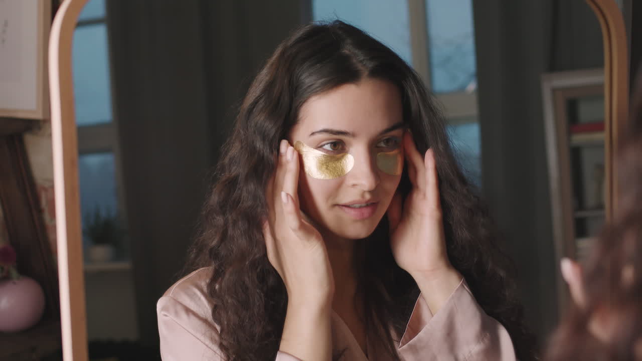 Beautiful Woman With Eye Patches Looking In Mirror
