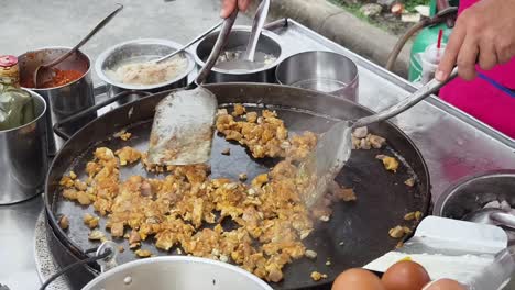 street food cooking: stir-fried egg and pork