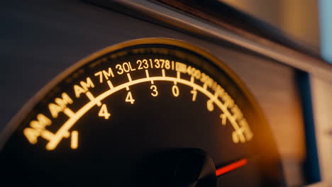 close-up of a vintage illuminated radio dial