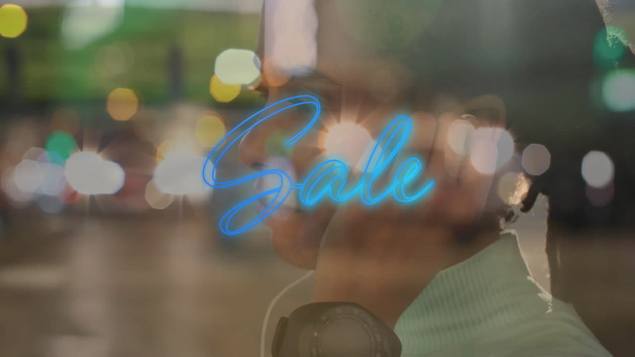 woman wearing headphones standing on street showcasing glowing retail sale text and bokeh lights