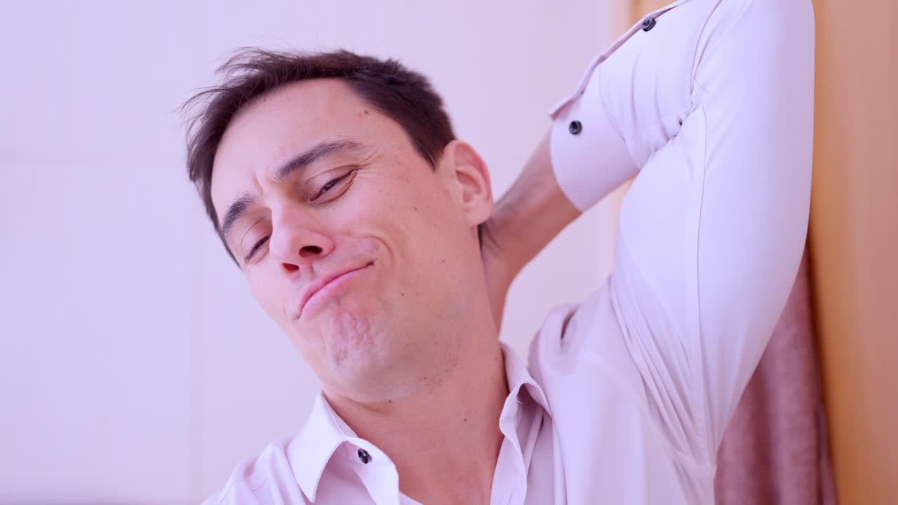 Narcissistic man taking selfies with smartphone in bathroom mirror