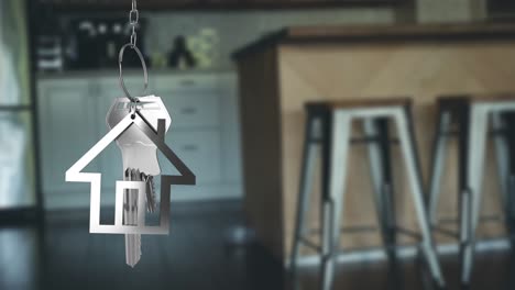 house keys and key fob hanging over out of focus kitchen 4k