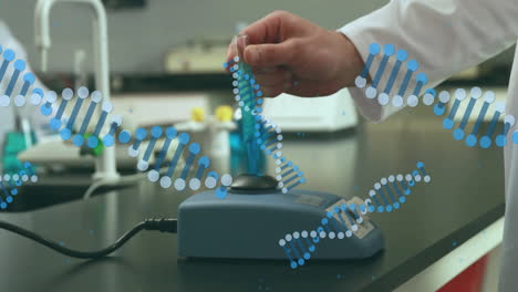 animating dna strand over scientist working with laboratory equipment in lab