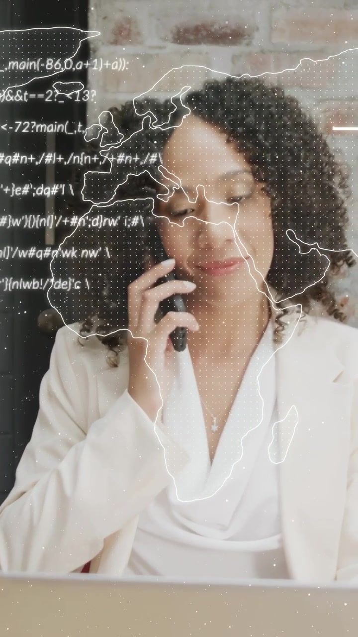 Vertical video: Woman checking phone after buzz, calling while viewing laptop map and data for work