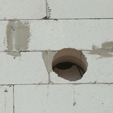 drilling into thick wall of house