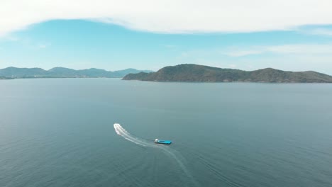 One-motorboat-roaring-towards-Coral-Island,-Thailand