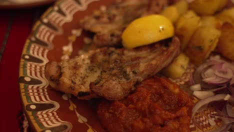 Combination-plate-of-steak-with-roast-potatoes-and-vegetables