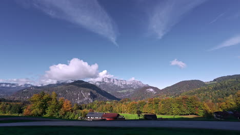 Village-below-the-mountains-in-an-autumn-landscape---driving-point-of-view