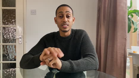 young man on video call telling story to his friends directly to camera