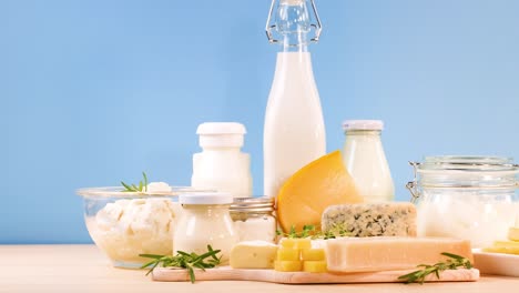 assorted dairy items displayed against a blue backdrop