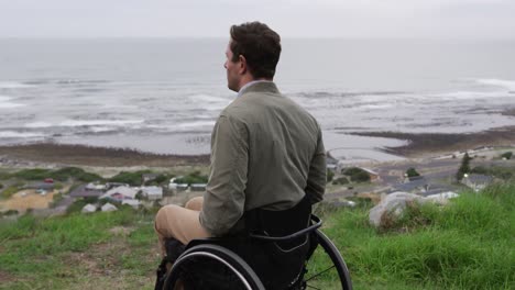 Man-in-a-wheelchair-looking-at-the-sea