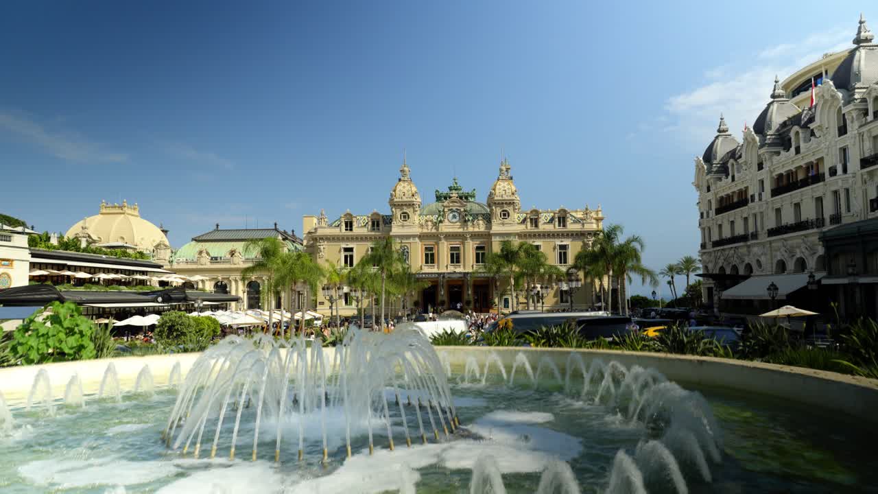 Fountain in front of the iconic Monte Carlo Casino in Monaco on a sunny day