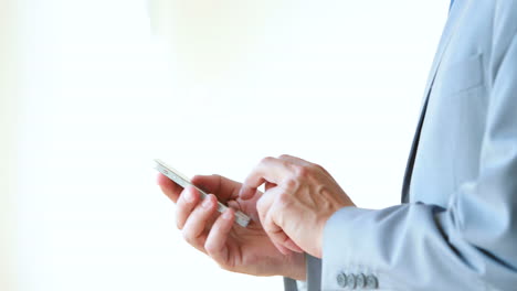 Businessman-using-laptop-and-answering-a-phone-call