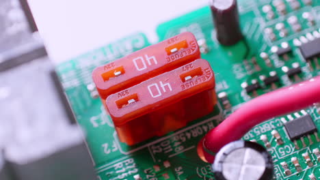 a close up and a zoom out of the terminal blocks on a circuit board