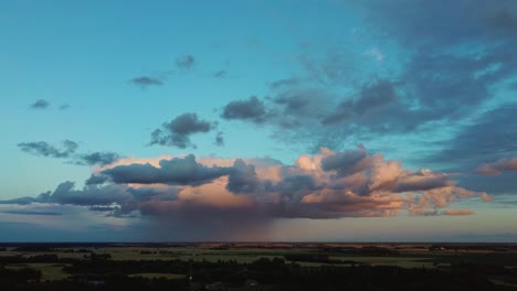 storm clouds with the rain. nature environment tornado warned supercell storm rolling through the plains. crop field after rain and storm clouds in background rural countryside. aerial dron shot