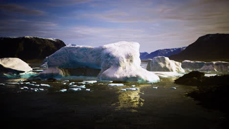 stunning icebergs floating in a tranquil arctic lagoon during golden hour