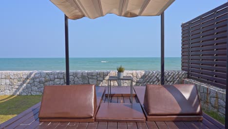 outdoor patio with pillow sofa deck chair around sea beach ocean