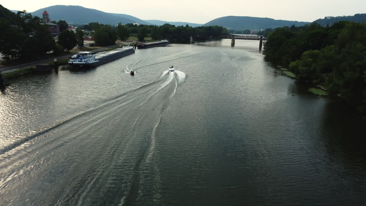 River Scene with Boats and Bridge