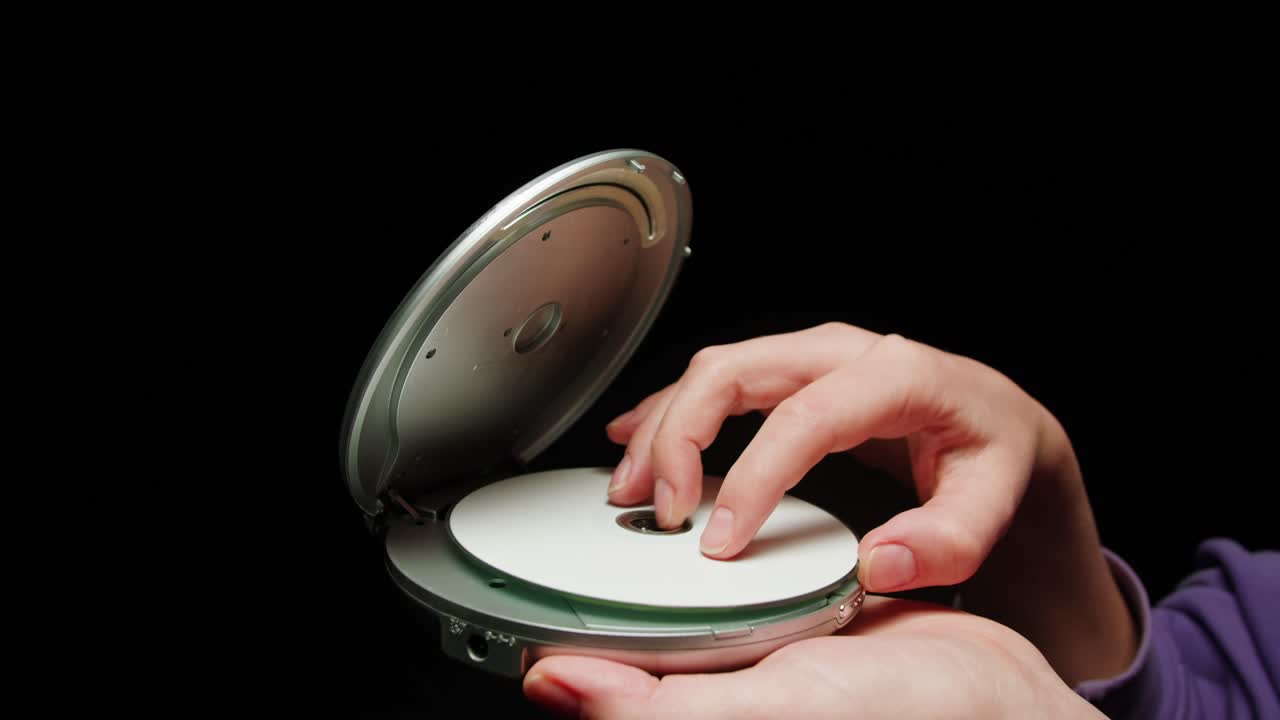 Vintage cd music player close-up. Using portable music player for listening with compact disc