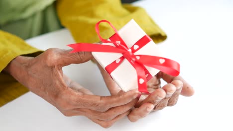 elderly woman receiving a gift