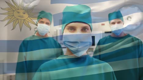 Animation-of-flag-of-uruguay-waving-over-surgeons-in-operating-theatre