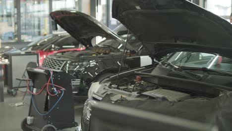 cars undergoing maintenance in auto repair shop