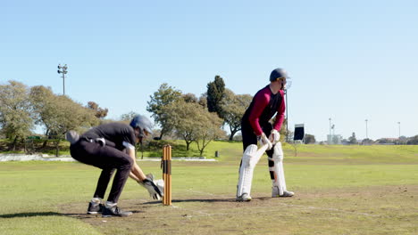 cricket players in action on field, batsman swinging, wicketkeeper ready