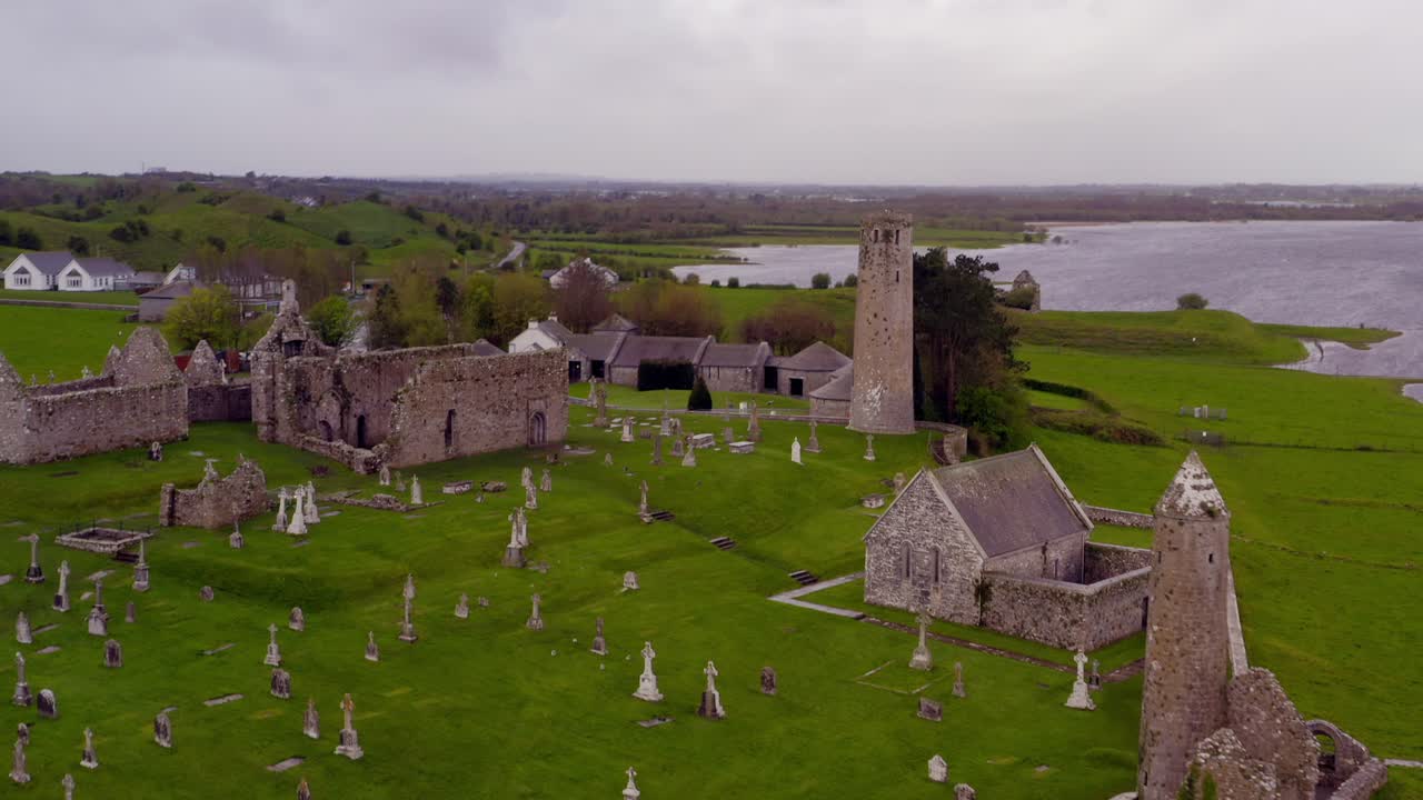 Aerial panoramic view reveals Clonmacnoise ruins with Shannon River in background