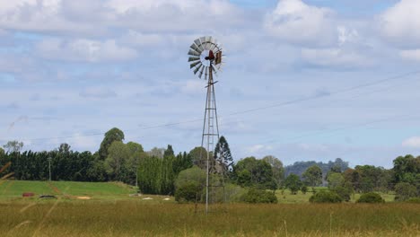 time-lapse of a windmill in changing weather conditions