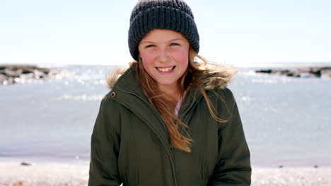 Face,-beach-and-young-child-with-ocean