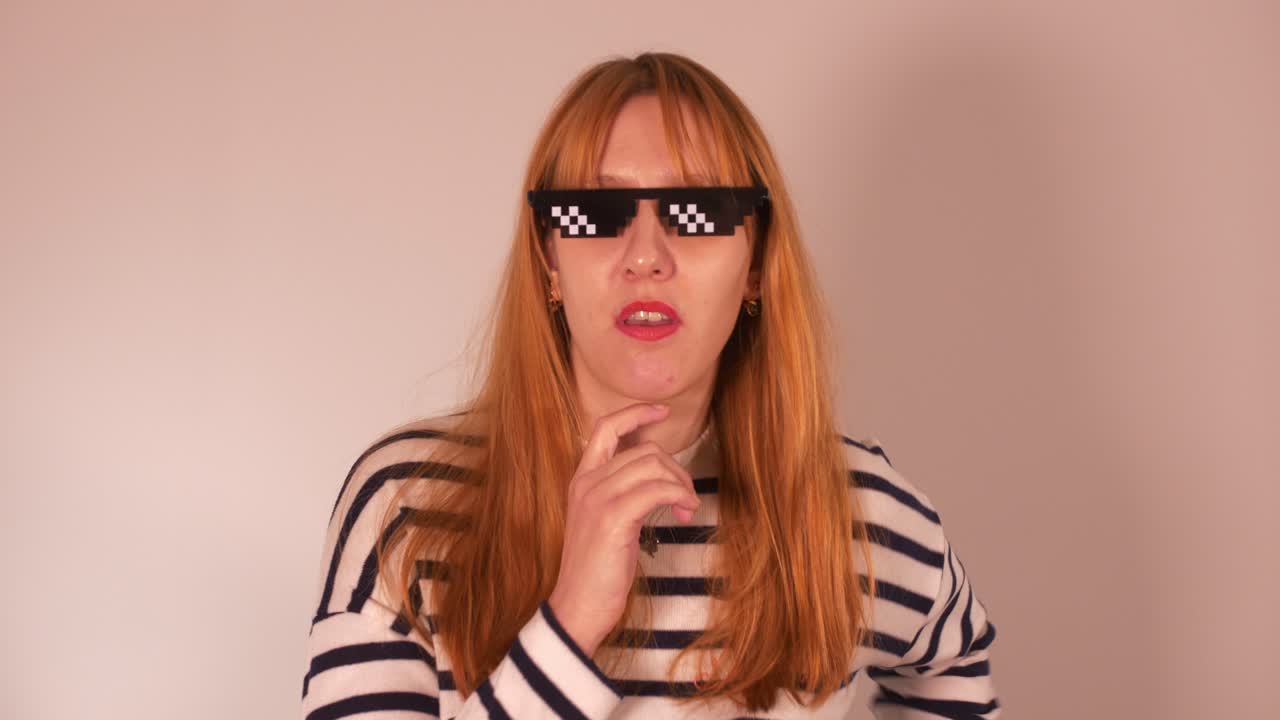 beautiful girl wearing meme glasses and making faces