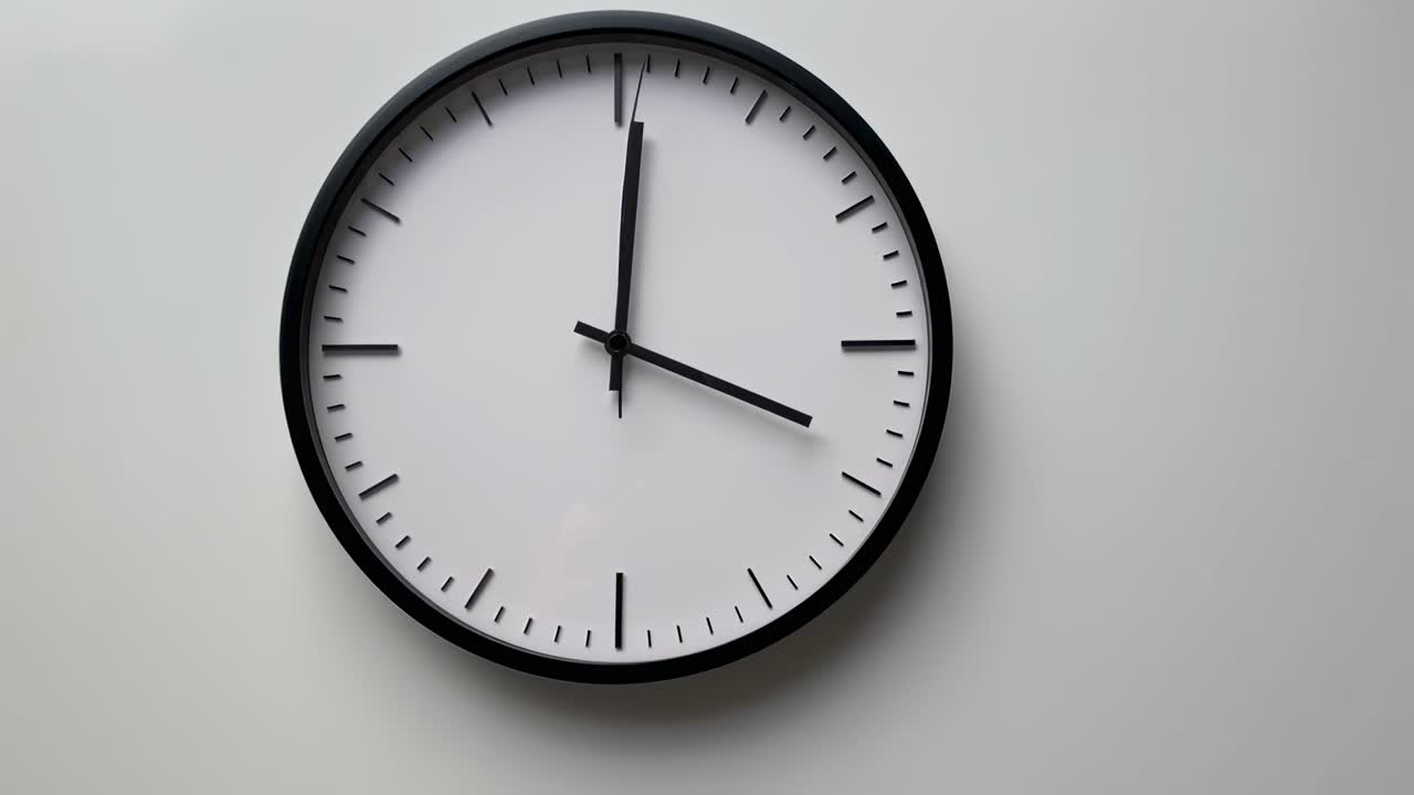 Minimalist wall clock captured from a straight-on angle, ideal for a time-lapse video