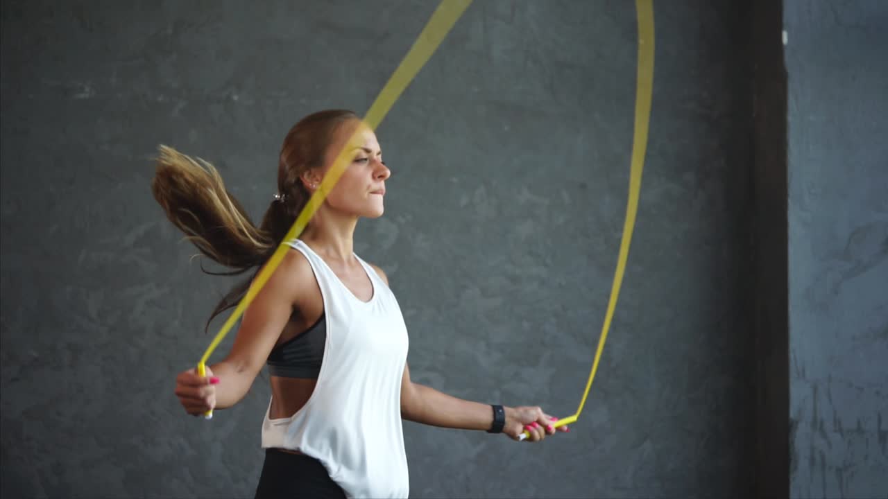 Woman Jumping Rope in Gym