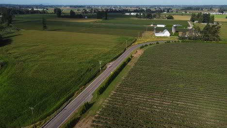 drone flying over road and farms in sumas, washington