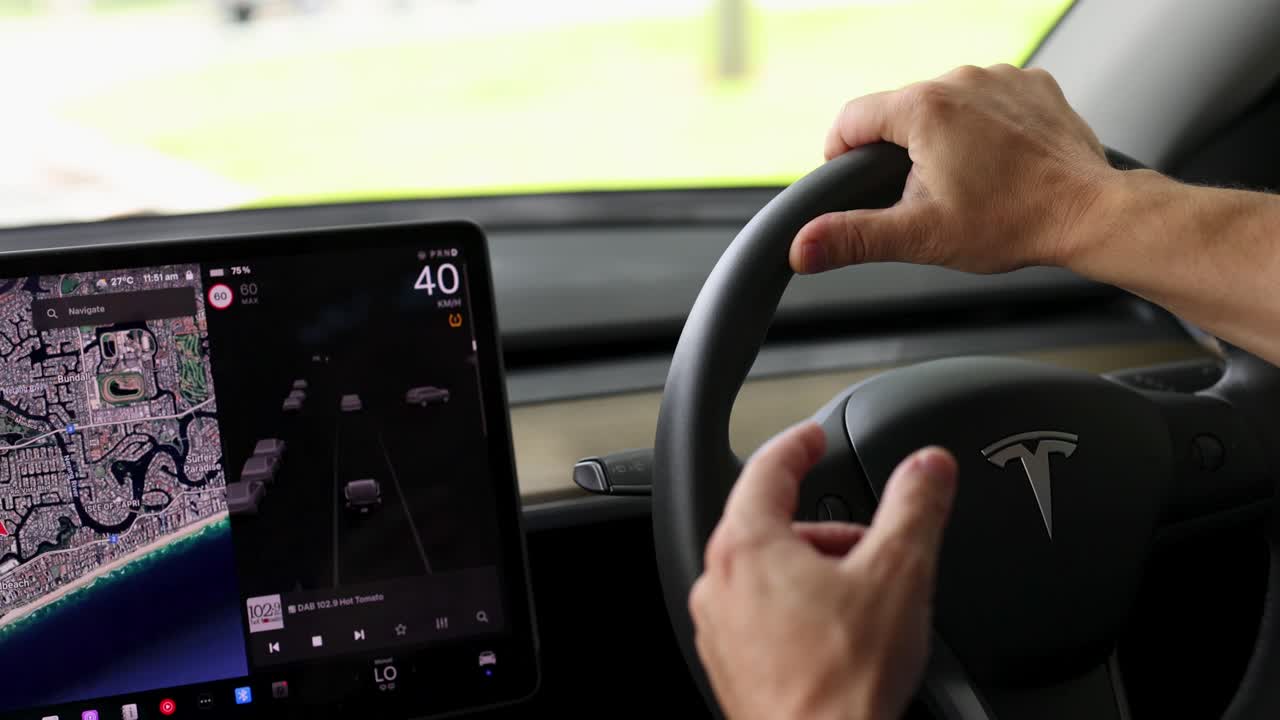 Driver interacts with a car's steering wheel and navigation screen, showcasing a smooth driving experience with real-time map updates