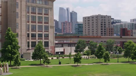 Aerial-crane-of-Denver-city-cityscape-over-residential-building-reveal-urban-area-and-public-park