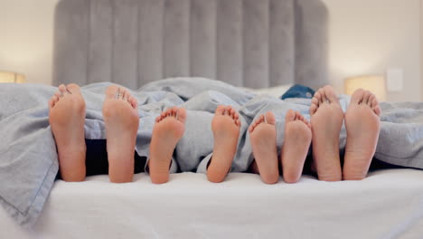 sleeping, feet and family in a bed relax