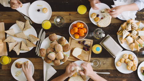 Timelapse-mixed-group-of-people-eating-lunch-aerial-view-organic-food-togetherness-concept