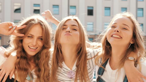 three young women having fun in the city