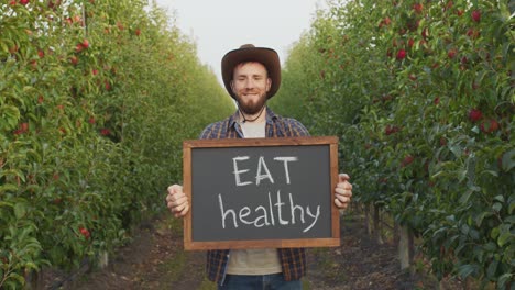 farmer promotes healthy eating in apple orchard