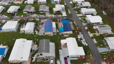 4k drone video of roof tarps on mobile homes damaged by hurricane ian in north port, florida - 24