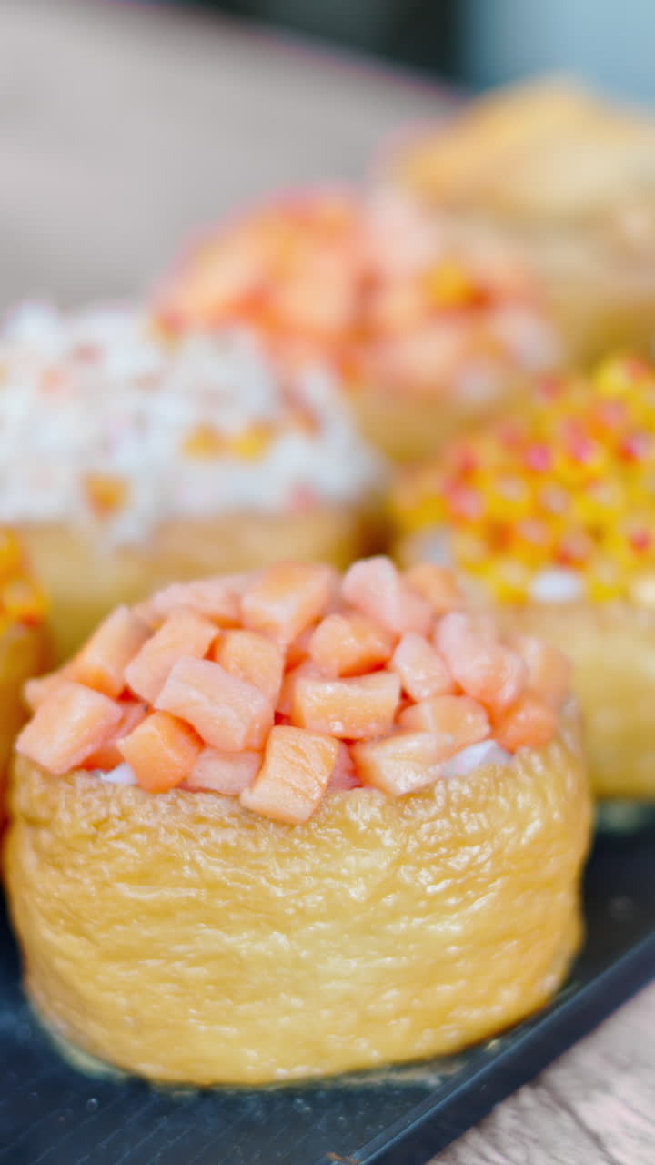 Close up of rolls at the Tsukiji Fish Market in Chuo, Japan. Vertical