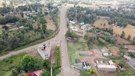 Aerial-drone-view-Open-Air-market-in-the-Loitokitok-town,-Kenya-and-mount-Kilimanjaro--Rural-village-of-Kenya